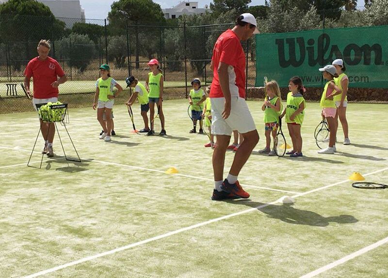 Tennis lesson in progress at Albufeira Clube de Ténis